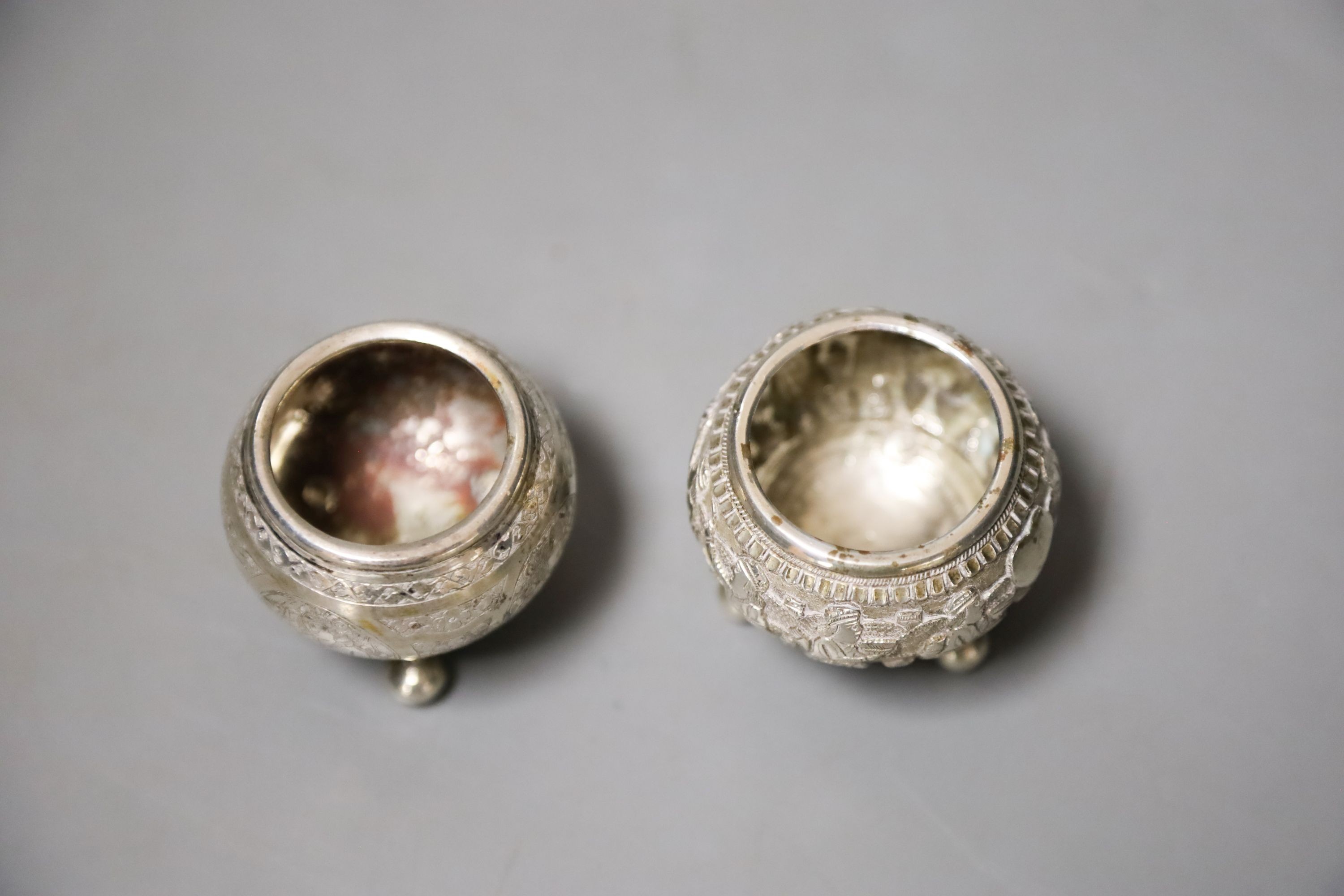 Two small Indian white metal condiments, tallest 57mm.